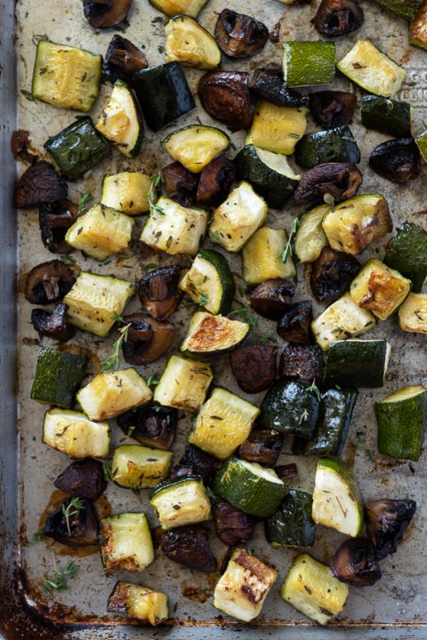 Sheet pan with caramelized roasted zucchini and mushrooms