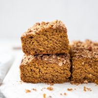 pumpkin coffee cake stacked up on a marble board