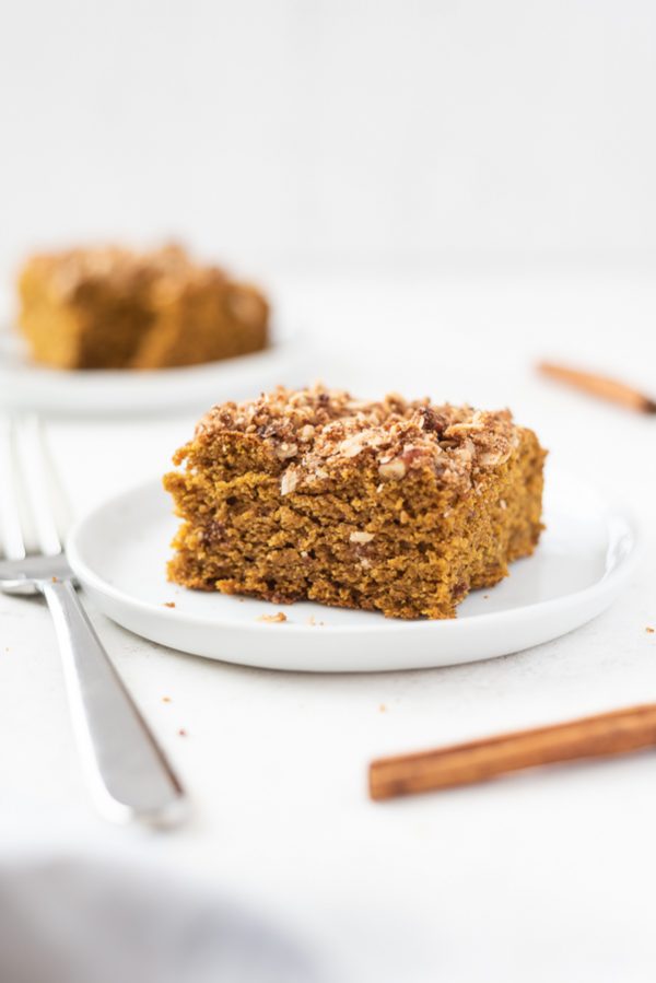 Piece of pumpkin coffee cake on a white plate