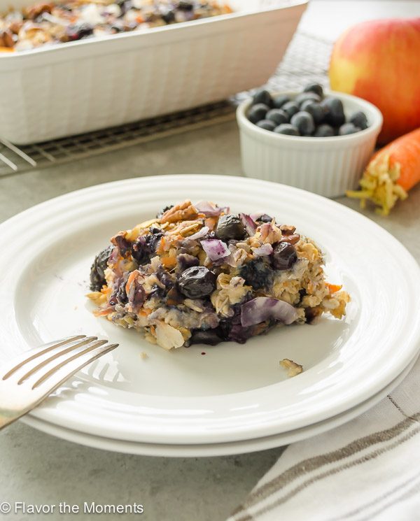 Serving of blueberry morning glory baked oatmeal on a white plate