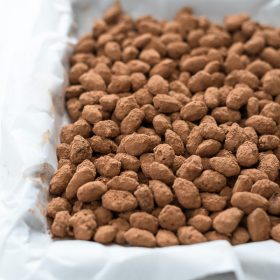 Almond dragees on baking sheet