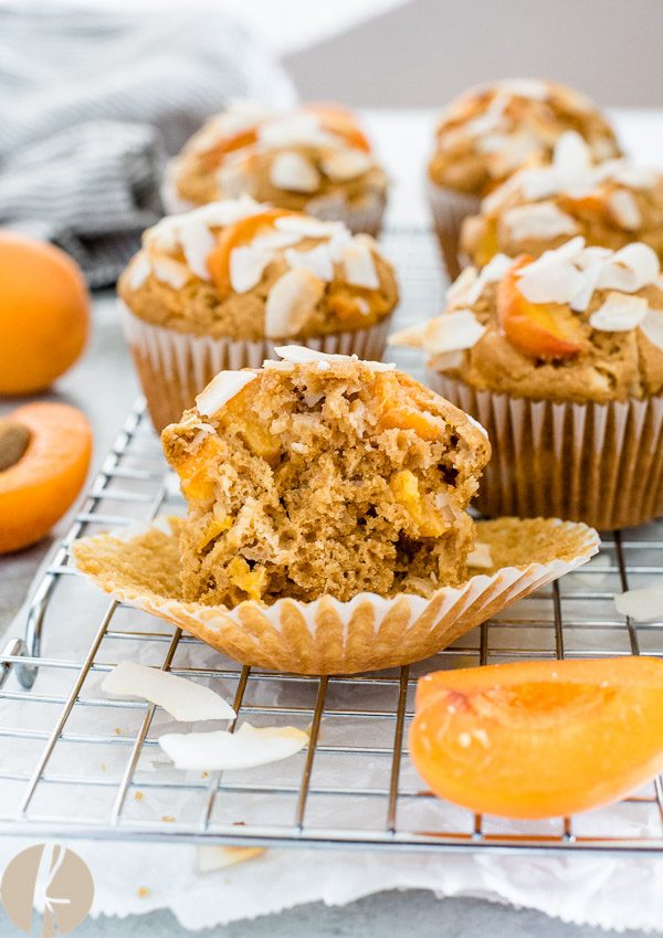Apricot muffin with liner peeled off and cut in half