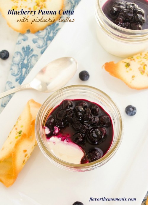 Blueberry panna cotta in jar with bite taken out