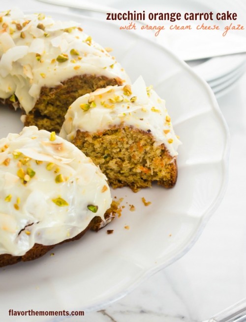 Zucchini carrot bundt cake on pedestal with slice removed