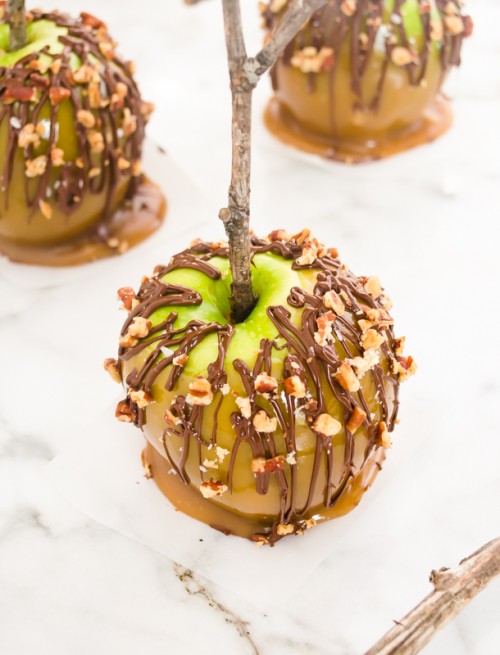 Homemade caramel apple with chocolate drizzle and pecans