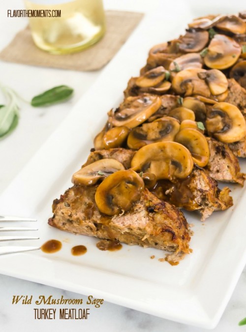 Turkey meatloaf with mushrooms on a platter with mushrooms on top
