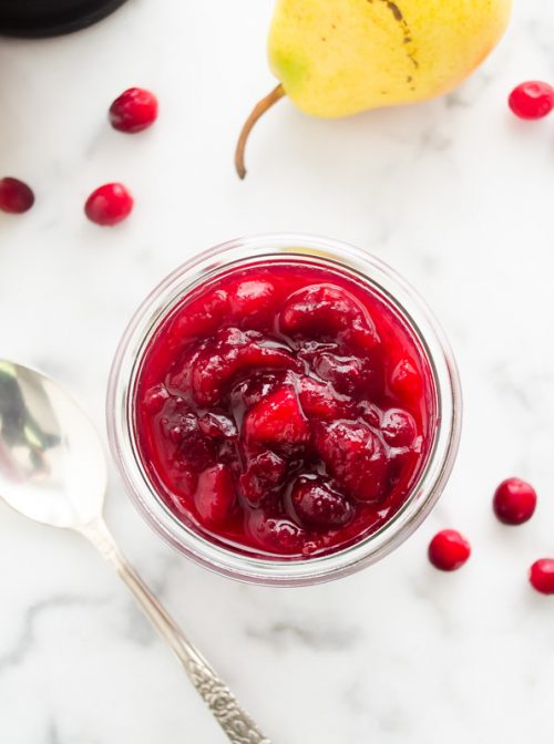 Overhead of cranberry pear sauce in a jar
