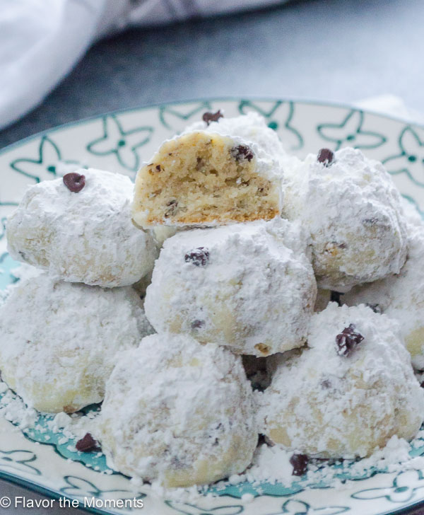 Close up of chocolate chip snowball cookies on a plate