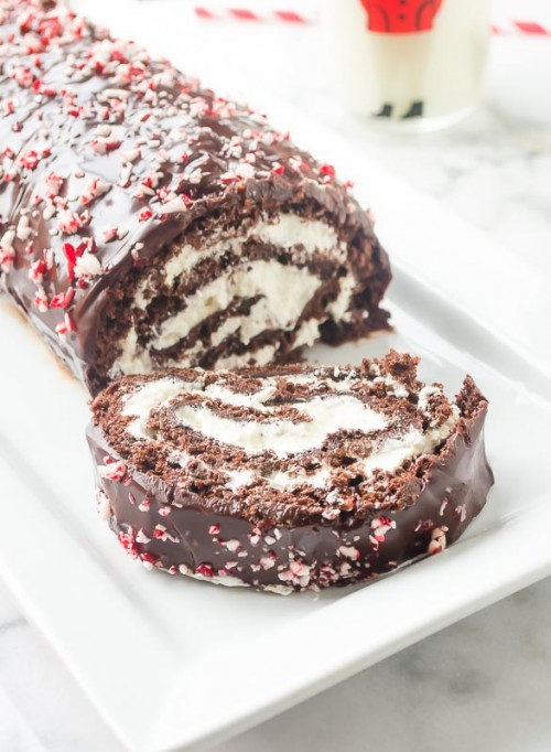 Close up front view of peppermint mocha cake roll with slice