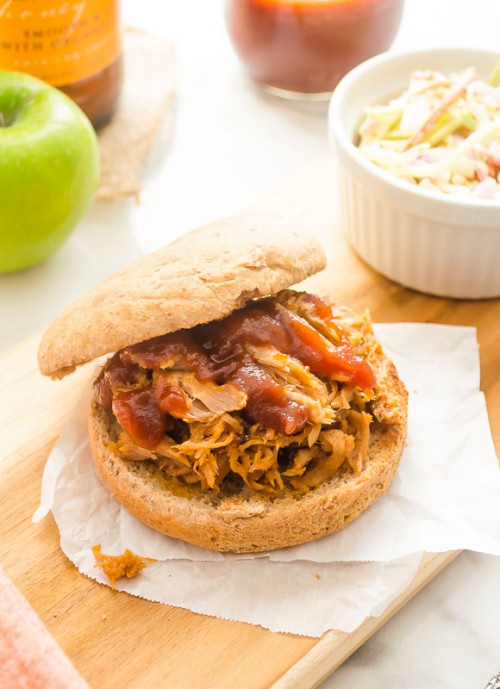 Hard apple cider pulled pork sandwich with bbq sauce on top