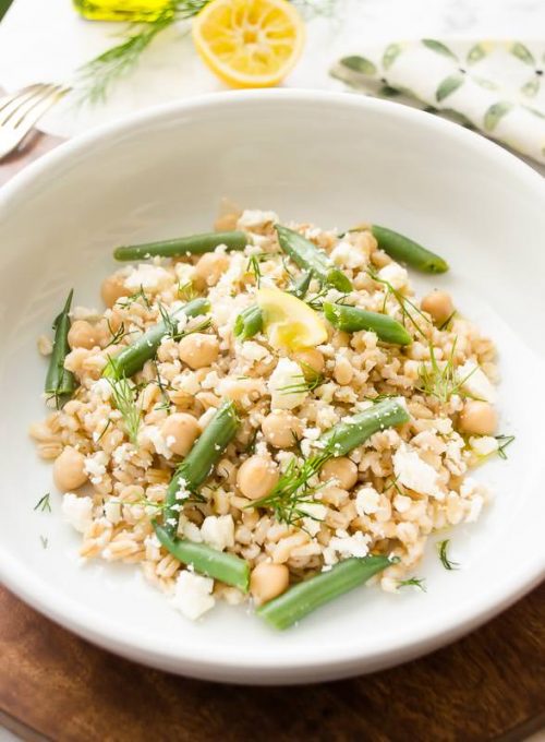 Close up of pearl barley salad in white bowl