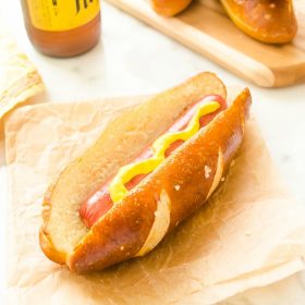 Hot dog in soft pretzel hot dog bun with mustard