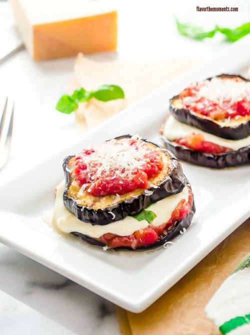 Healthy eggplant parmesan on a white plate