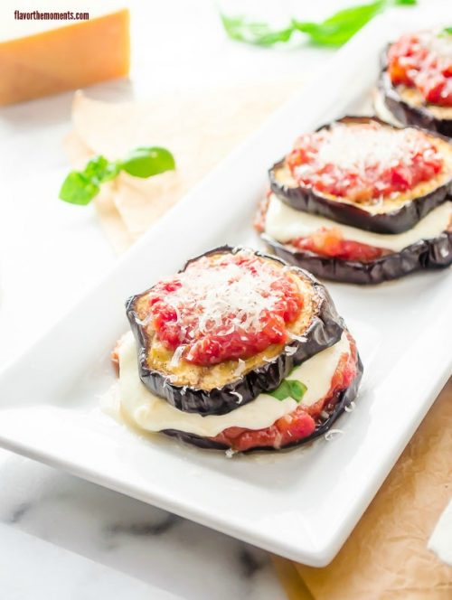 Eggplant parmesan stacks on a white plate