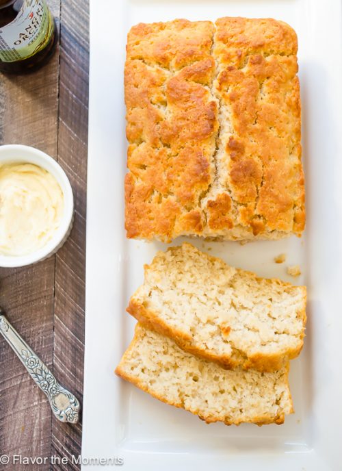 overhead shot of hard apple cider beer bread sliced on serving platter