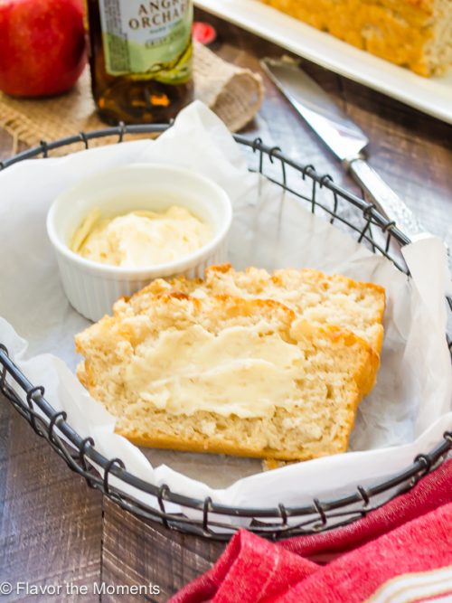 hard apple cider beer bread sliced and served with maple butter in wire basket