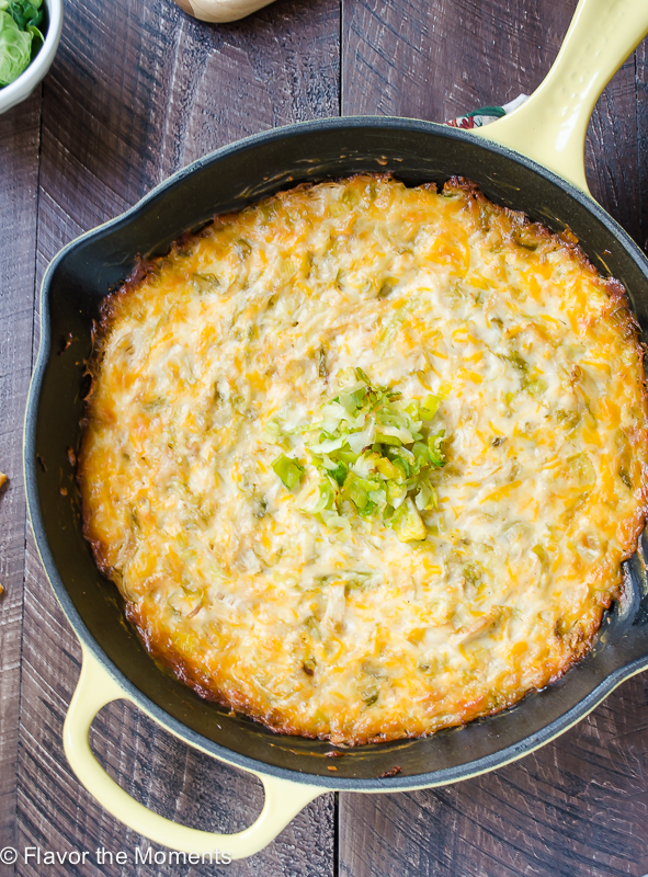 Cheesy caramelized brussels sprout dip in a cast iron skillet