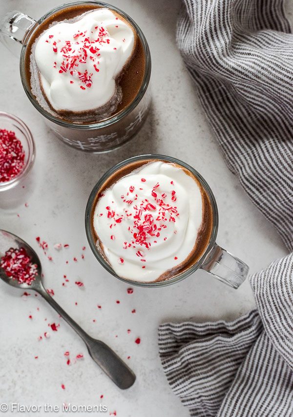 Slow Cooker Peppermint Hot Chocolate in mugs with whipped cream and peppermint