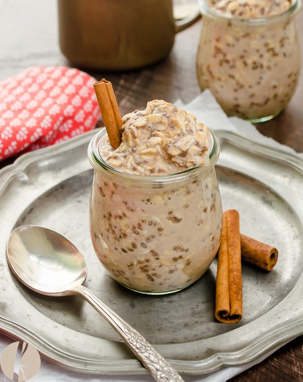front view of overnight oats with cinnamon sticks