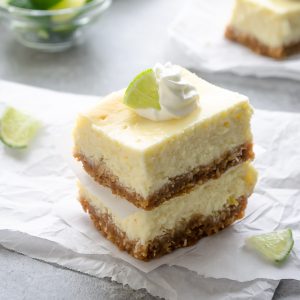 front view of key lime cheesecake bars stacked up