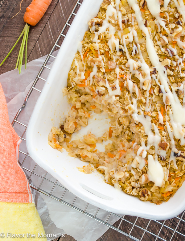 carrot cake baked oatmeal in white baking dish with serving missing