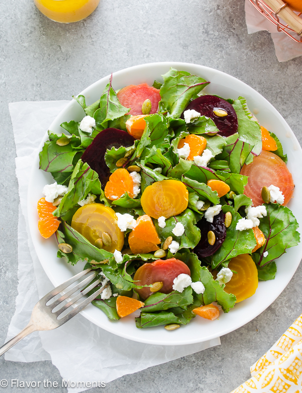 Roasted Beet Salad with Goat Cheese and Orange is sweet roasted beets with beet greens, goat cheese, and orange tossed in a white balsamic vinaigrette. It's sweet, savory, and perfect for beet lovers! @FlavortheMoment