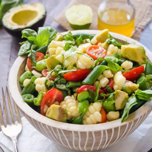 close up front view of summer succotash salad in bowl