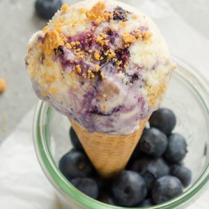 Blueberry Pie Ice Cream cone with graham cracker crumbs on top