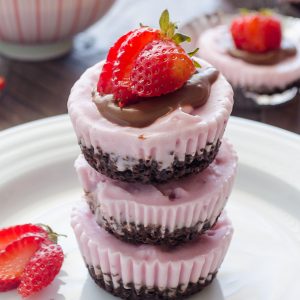brownie bottom ice cream cupcakes stacked up with strawberries on top