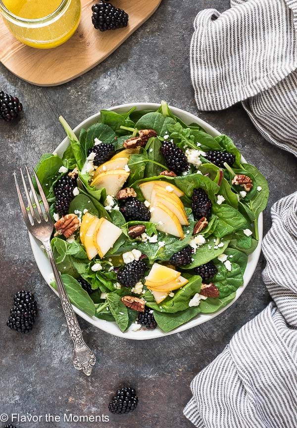 overhead shot of power greens salad with linen