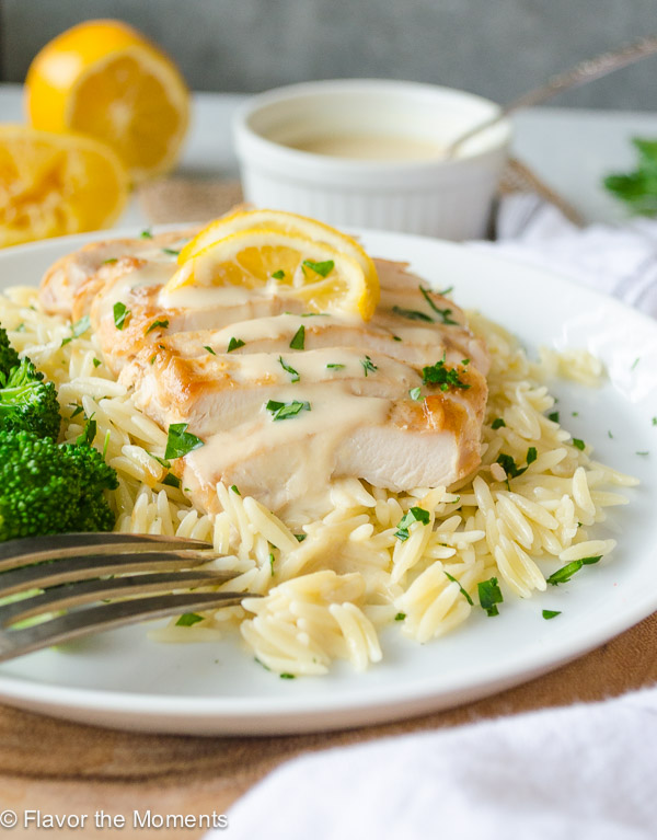 30-Minute Chicken with Greek Avgolemono Sauce is pan fried chicken smothered in a silky smooth, lemony Greek avgolemono sauce. Serve with rice or orzo for a quick, delicious weeknight meal! @FlavortheMoment