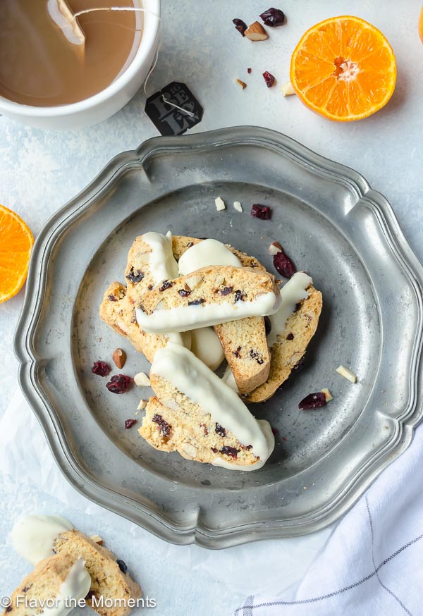 overhead shot of cranberry orange biscotti piled on silver plate