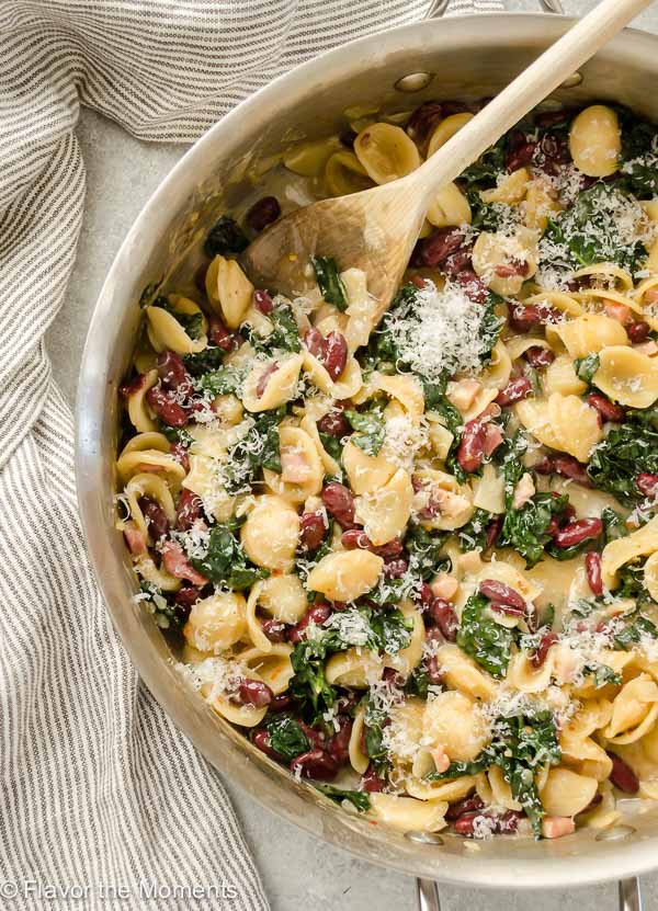 One Pot 30-Minute Pasta e Fagioli is a hearty one pot pasta dish with pancetta, beans, kale, and plenty of parmesan. It requires minimal prep and will become a family favorite! @FlavortheMoment