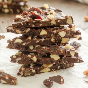 pile of chocolate bark with almonds and dried cranberries