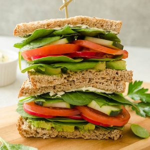 veggie sandwich on a cutting board