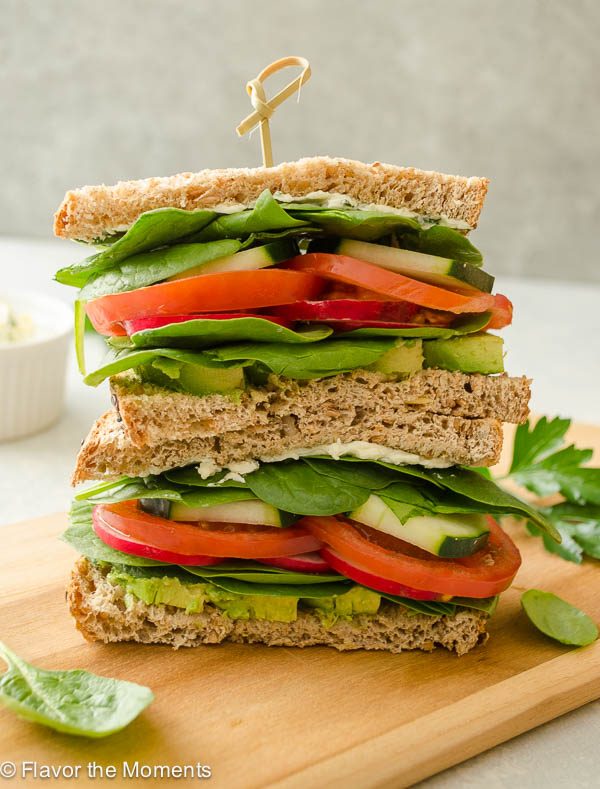 Ultimate Veggie Sandwich with Lemon Herb Cream Cheese is whole grain bread with a flavorful cream cheese spread piled high with fresh veggies. It's a delicious lunch that you can feel good about! @FlavortheMoment