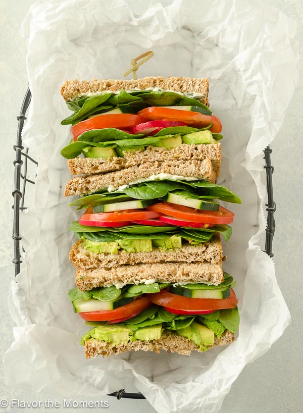 Ultimate Veggie Sandwich with Lemon Herb Cream Cheese is whole grain bread with a flavorful cream cheese spread piled high with fresh veggies. It's a delicious lunch that you can feel good about! @FlavortheMoment