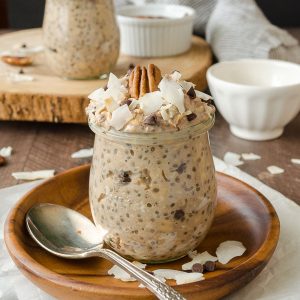 Jar of german chocolate overnight oats with pecan and coconut on top