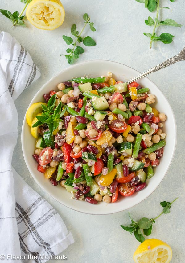 Greek Three Bean Salad is classic three bean salad with a Greek twist! It's packed with protein and veggies and is the perfect side dish or lunch! @FlavortheMoment