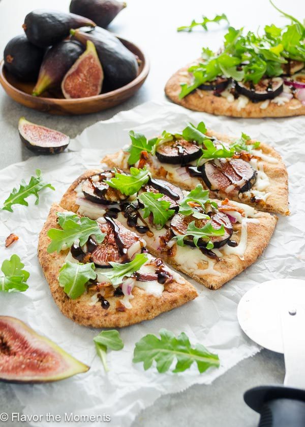 front shot of sliced fig pizza on parchment paper