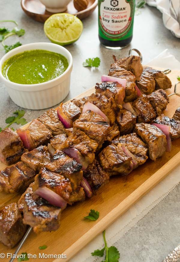 overhead shot of honey soy steak kebabs with cilantro lime sauce