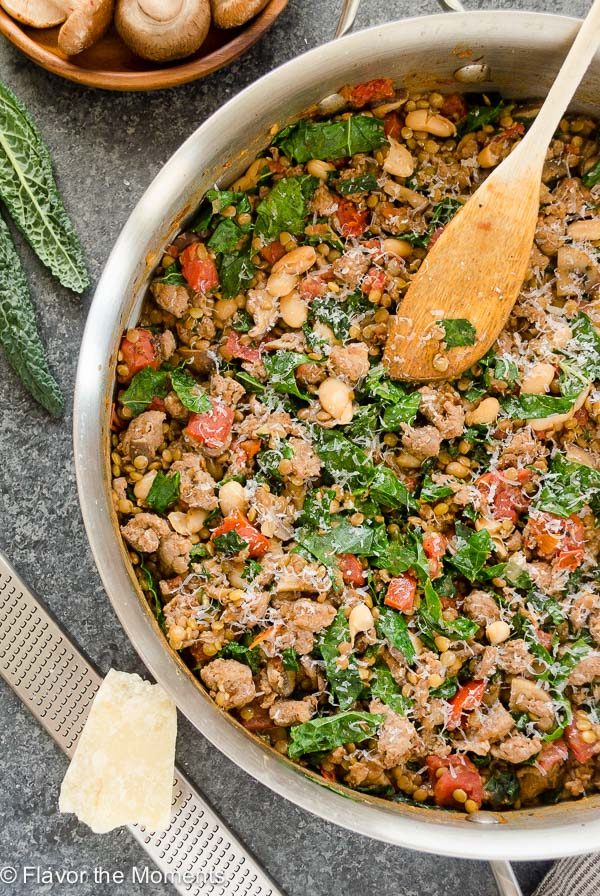 Lentil casserole in skillet with wooden spoon