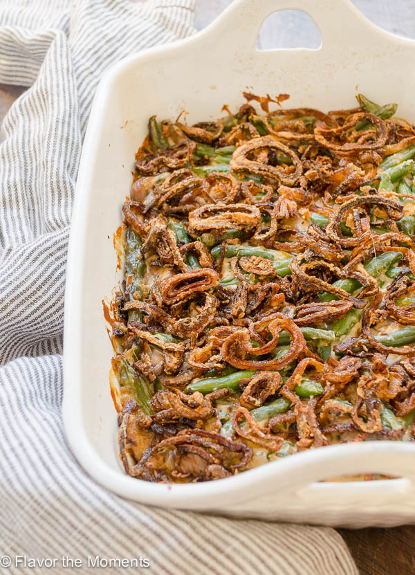 Homemade green bean casserole in baking dish with crispy shallots on top