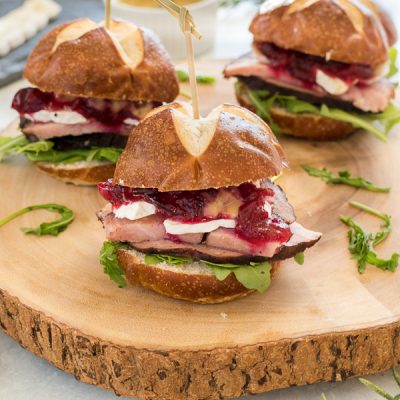 Ham, Brie and Cranberry Sliders with Maple Rosemary Mustard are festive, flavorful sliders that are perfect for holiday entertaining!
