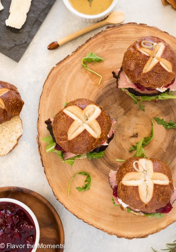 Ham sliders on a wooden serving plate