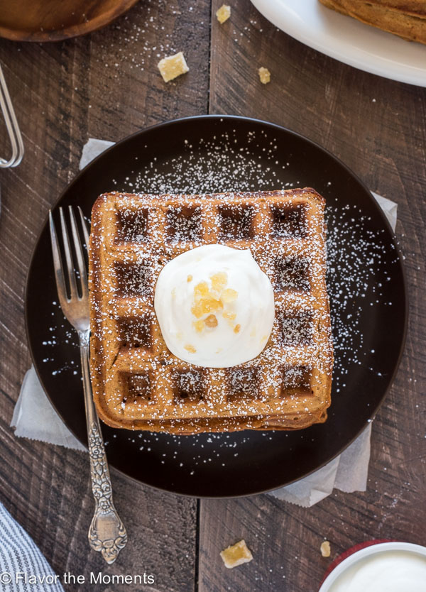 Gingerbread waffles on a plate with a fork
