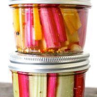 Pickled swiss chard stems in two mini mason jars