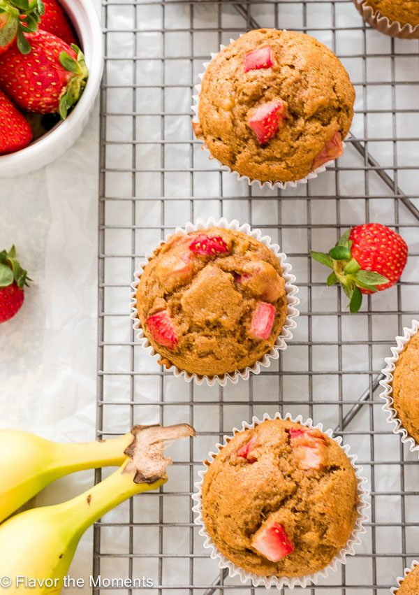 overhead shot of strawberry banana muffins on wire rack