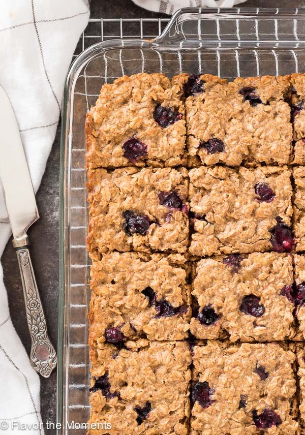 Blueberry Banana Almond Butter Oat Bars on a wire rack