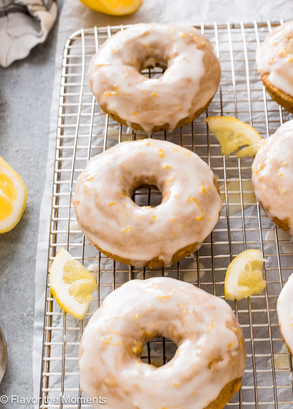 close up front shot of lemon donuts on wire rack